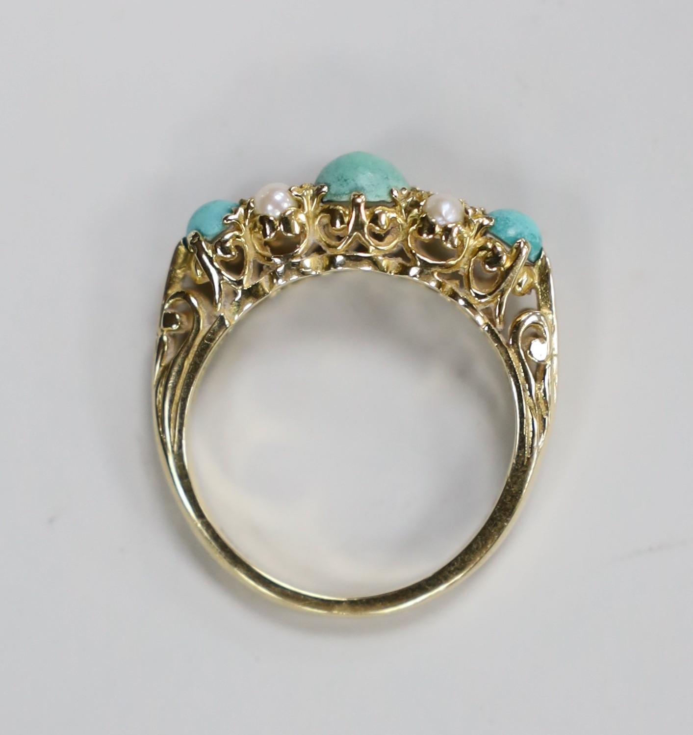 A 1960's 9ct gold, split pearl and turquoise ring set half hoop ring, size O, gross weight 3.4 grams.